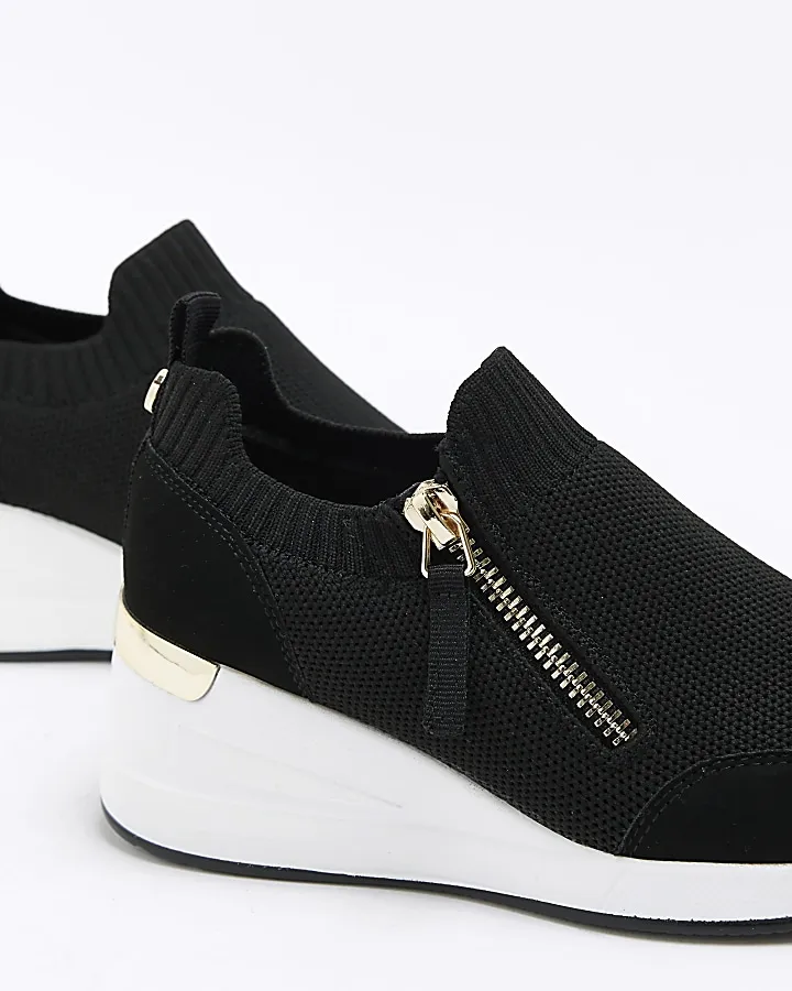 Girls black wedge trainers