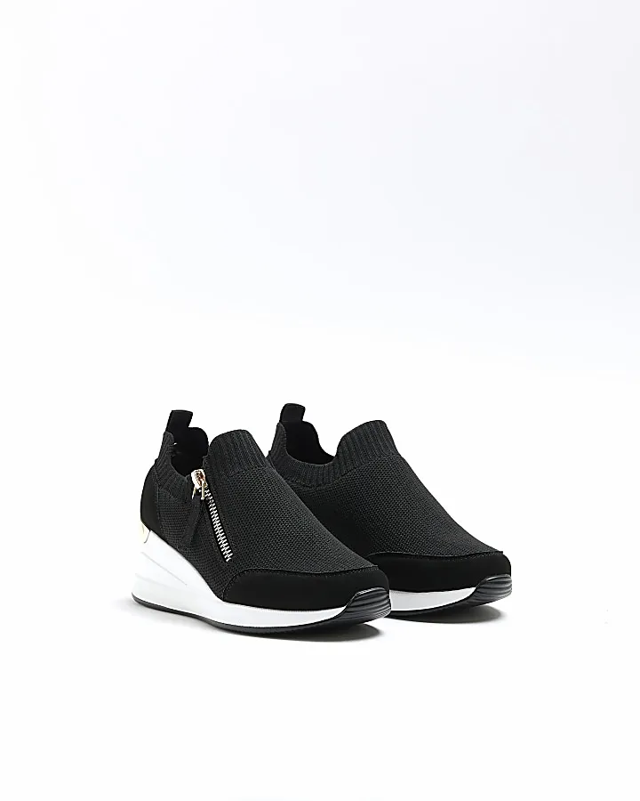 Girls black wedge trainers